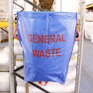 Warehouse recycling sack for general waste hanging on racking in warehouse